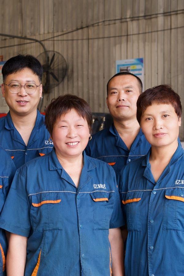 Our workers are smiling and standing in a line.