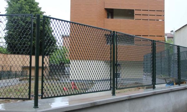 Dark green common expanded metal fence partial details
