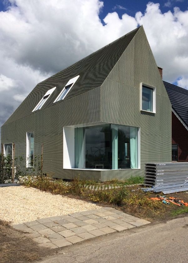 The villa is covered with expanded metal facade.