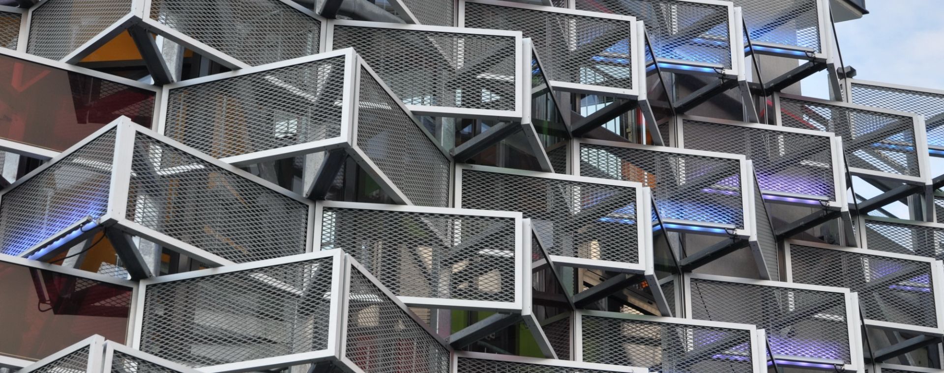Decorative expanded metal panels are installed on the exterior wall of buildings.