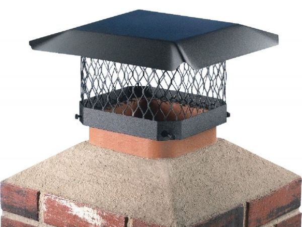 Black expanded metal chimney cap is installed over the chimney.