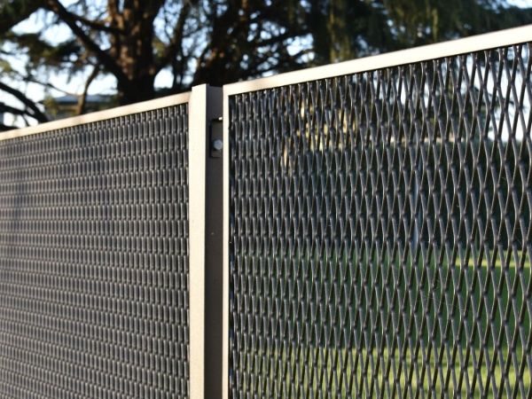 Partial details of framed expanded metal security fence