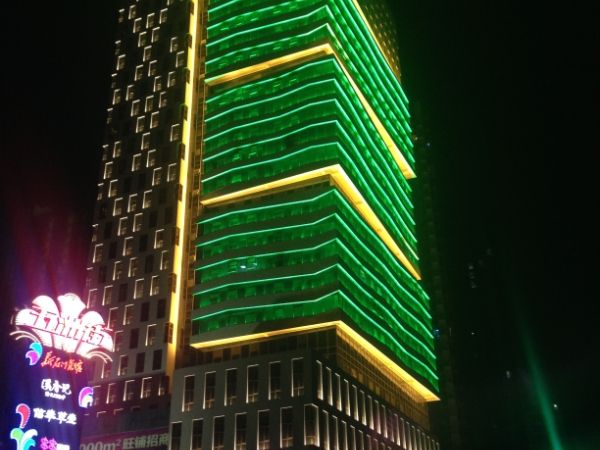 Exterior shot of the office building at night.