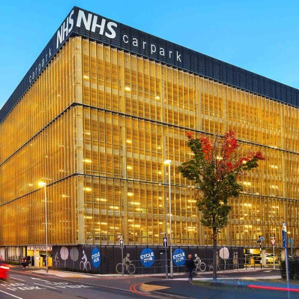 Golden expanded metal facade is installed around the shopping mall exterior walls.